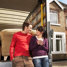 Couple in front of moving truck - MGIC Homebuyer Education